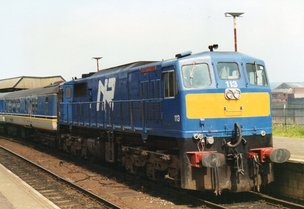 Northern Ireland Railways GM 113 waits in Belfast Central with "The Enterprise" in the early 1990's