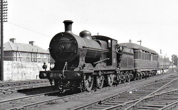 Class J 4 - 261 - GS&WR Class 257 0-6-0, built 1914 by Inchicore Works - 1925 to GSR, 1945 to CIE, 1948 rebuilt with Belpaire boiler - withdrawn 1965 - seen here with ex-Pullman car and 2 new coaches.