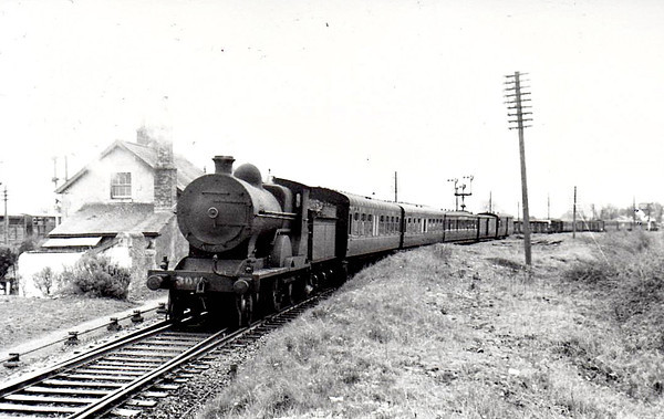 Class D12 - 306 - GS&WR Class 305 4-4-0, built 1902 by Inchicore Works - 1906 rebuilt, 1925 to GSR, 1931 rebuilt with Belpaire boiler, 1935 rebuilt with larger diameter boiler, 1945 to CIE - withdrawn 1959 - seen here at Limerick Junction in 1955.