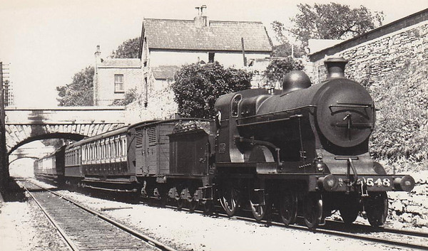 Class D 5 - 548 - M&GWR Class A 4-4-0, built 1904 by Broadstone Works as Midland & Great Western Railway No.126 ATLANTIC - 1925 to GSR as No.548, 1925 rebuilt with Belpaire boiler, 1945 to CIE - with drawn 1955 - seen here near Broadstone - note Pullman car (2nd vehicle) - 1 of only 3 that ever ran in Ireland.