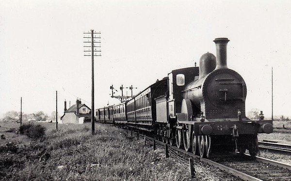 Class D14 - 64 - GS&WR Class 60 4-4-0, built 1895 by Inchicore Works - 1925 to GSR, 1941 rebuilt with Belapire boiler, 1945 to CIE - withdrawn 1959 - seen here at Limerick Junction in 1938.