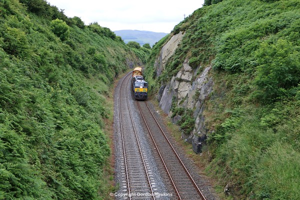 12.7..16. GM 077 with the Irish Rail Weed Sprayer  passes the Wellington Cutting outside Newry  heading from Dundalk to Newry.