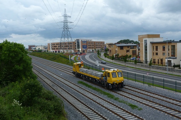 IE's MPV 790 operating from Portlaoise to Dublin with a load of concrete sleepers. Lucan South, Friday, 22/06/12