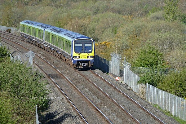 28.4.18. Irish Rail Caf sets 29008 & 29023 pass Craigavon Lakes working the 07:35 Dublin to Belfast Enterprise service