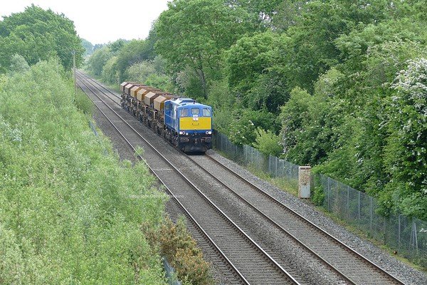 1.6.18. NIR GM 8113 passes Silverwood Lurgan on a Ballast Hopper transfer from Belfast to Poyntzpass.