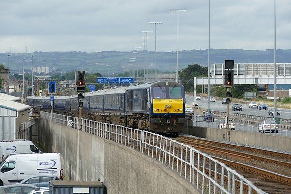 4.8.18. GM 216 with the Belmond Grand Hibernian Train  heads from York Road Depot to Belfast Central Station .