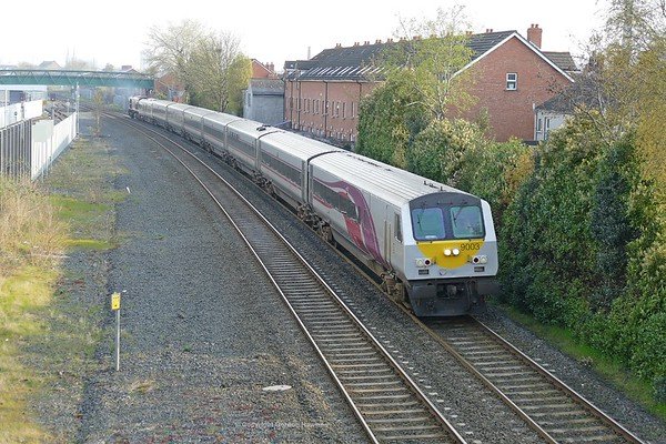 7.4.19.  The 09:00 Belfast to Dublin Enterprise service passes Adelaide Belfast work by DVT  9003 & GM 227.