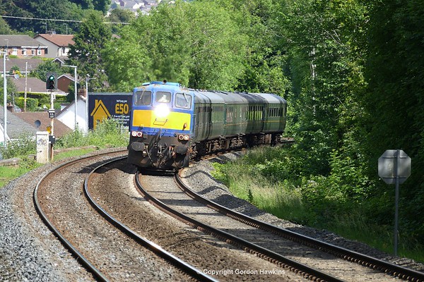 20.6.17. NIR GM 112 hauls the RPSI MK2 carriages working the 09:36 Whitehead to Dublin Connolly ECS  for the Steam Dreams Railtour  . the train is seen here passing Hilden Halt  heading for Dublin.