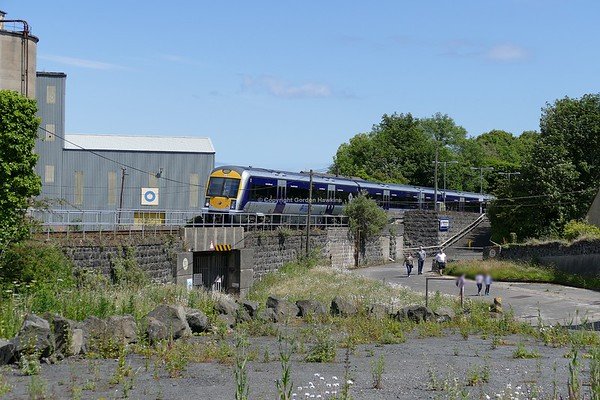 6.7.19. NIR Caf set 3015 departs Magheramorne on a service train to Larne Harbour from Belfast.