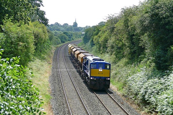 23.7.19. GM 8113 with the NIR ballast train  passes Terryhoogan Road Scarva heading from Poyntzpass to Belfast.