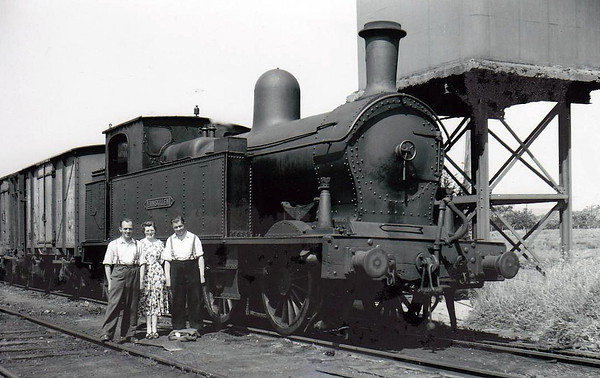 ENNISKILLEN - 'Sir Henry' Class 0-6-4T built 1905 by Beyer Peacock, Works No.4720 - withdrawn 1957 - seen here at Collooney with the station staff.