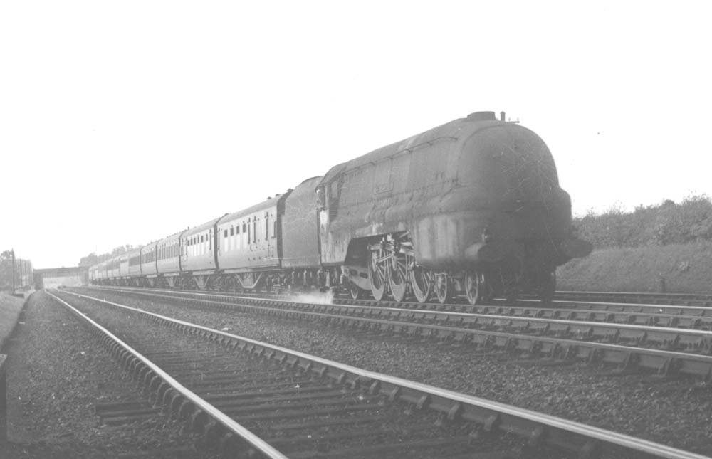 LMS 4-6-2 Princess Coronation class No 6237 'City of Bristol is seen in a very dirty condition as it speeds south on an up express