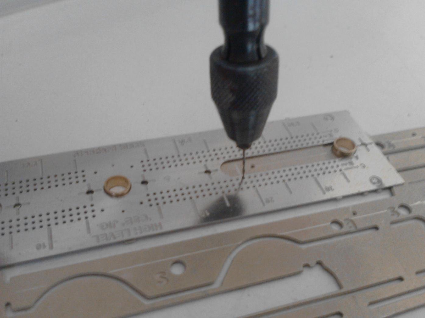 Using the jig to drill holes for fulcrum points
