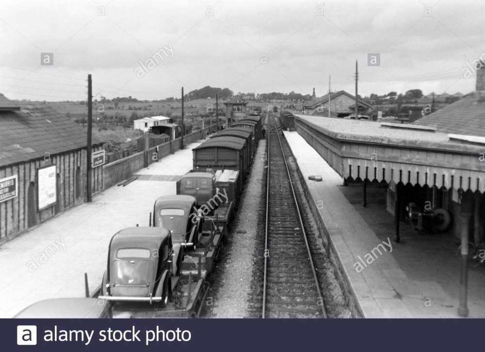 historic-monochrome-photograph-cars-on-goods-train-at-railway-station-claremorris-county-mayo-ireland-2AGMHDR.thumb.jpg.c503016c86f67b4fc10cdc844f173cf9.jpg